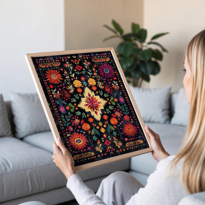 May include: A framed print of a colorful floral design on a black background. The design features a variety of flowers and leaves in shades of red, orange, yellow, green, and blue. The print is surrounded by a simple wooden frame.