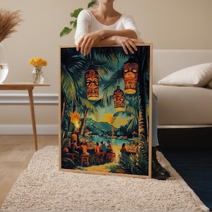 May include: A framed print depicting a tropical scene with tiki torches, palm trees, and a bar with people. The artwork features vibrant colors, including greens, yellows, and blues, creating a lively atmosphere. The print is held by a person.