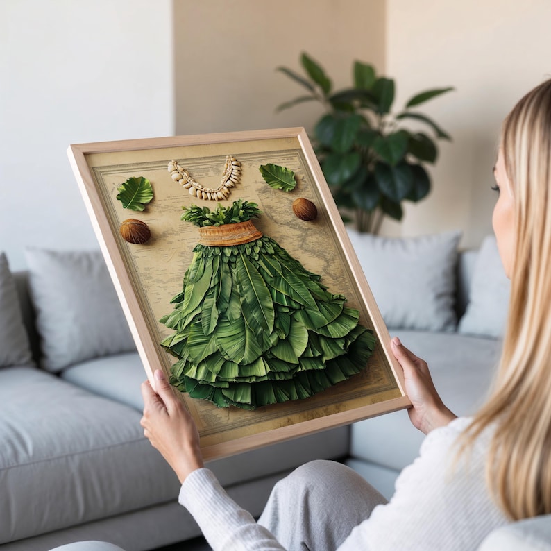 May include: A framed print of a green leaf skirt with a brown belt and a white shell necklace. The skirt is made of many leaves and is arranged in a circle. The background is a vintage map.