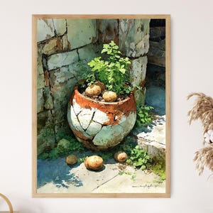 May include: A framed watercolor print of a terracotta pot with a cracked design, filled with plants and potatoes. The pot sits on stone steps, with additional potatoes scattered around. The artwork has a rustic, sunlit aesthetic.