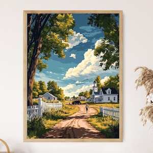 Puede incluir: Impresión artística enmarcada que representa un paisaje rural con un camino de tierra que conduce a un pueblo. La obra de arte presenta un cielo azul brillante con nubes blancas esponjosas, árboles verdes, vallas blancas y casas blancas.