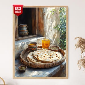 May include: A framed print depicting a still life with a woven tray holding flatbread, small bowls of spices, and a glass of amber liquid. The scene is set outdoors with a rustic window and greenery.