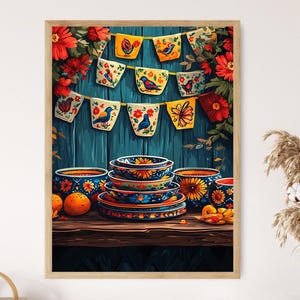 May include: A framed print featuring a vibrant still life. A wooden table displays a stack of colorful plates and bowls with floral designs. Above, a banner with bird and flower motifs hangs against a teal wooden backdrop, framed by red flowers.
