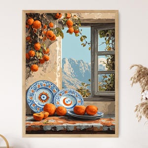 May include: A framed painting depicts a sunlit scene with oranges and blue and white plates. A window reveals a mountain view. The artwork features a rustic aesthetic, with a focus on still life elements and natural light.