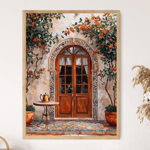 Peut inclure: Une impression d'art encadrée d'une peinture à l'aquarelle détaillée. L'œuvre représente une porte arquée en bois avec une petite table et une théière. La porte est entourée de vignes fleuries et de plantes en pot, avec un sol carrelé coloré.