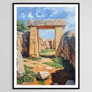 May include: A framed print of an ancient stone structure with a large doorway. The artwork depicts a sunny day with a blue sky and clouds. The structure is made of large, weathered stones, with green vegetation and rocks in the foreground.