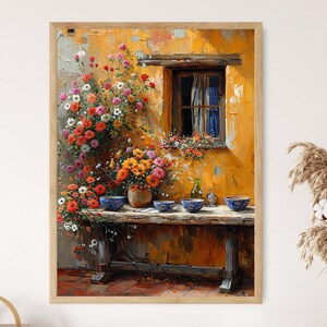 May include: A painting of a yellow building with a window and a flower box. There are flowers growing on the side of the building and a wooden table with blue bowls on it.
