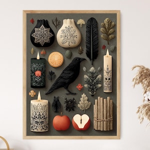 May include: A framed print featuring a collection of decorative objects with a dark, moody aesthetic. The arrangement includes candles, a raven, leaves, and fruit. The color palette is dominated by black, cream, and muted greens, with touches of red and orange.