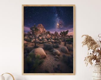 May include: A framed landscape print featuring a desert scene under a starry night sky. The image showcases Joshua trees, large boulders, and a vibrant Milky Way. The frame is made of light-colored wood, adding a natural touch to the artwork.