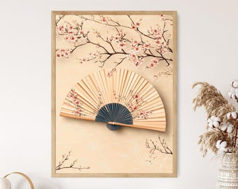 以下が含まれることがあります： 薄いベージュの背景に、ピンクの花が咲いた桜の枝と、青い中心とピンクの花のアクセントが付いた木製の扇子が描かれた額装されたプリントです。