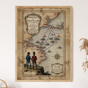 May include: A framed historical map print depicting the Battle of Trafalgar on 21st October 1805. The map features illustrations of naval ships, flags of Britain, France, and Spain, two military figures, a compass rose, and descriptive text.