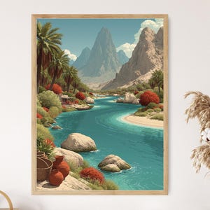 May include: A framed art print of a scenic landscape. The artwork depicts a turquoise river winding through a valley, flanked by mountains and palm trees. Red and green foliage adds color to the scene. The print is in a light wood frame.