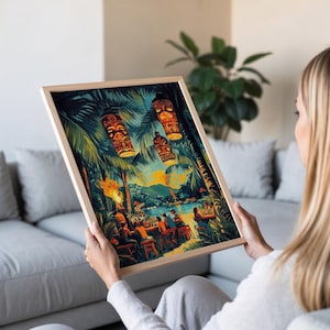 May include: A framed print depicting a tropical scene with tiki torches, palm trees, and hanging tiki lanterns. The artwork showcases a vibrant beach bar setting with people enjoying drinks. The frame is a light wood color.