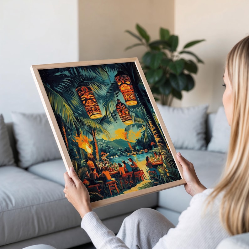 May include: A framed print depicting a tropical scene with tiki torches, palm trees, and hanging tiki lanterns. The artwork showcases a vibrant beach bar setting with people enjoying drinks. The frame is a light wood color.
