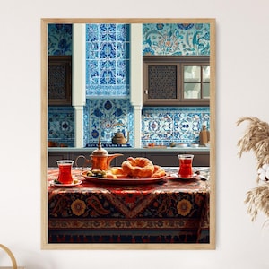 May include: A framed print of a kitchen scene with a table set for tea. The table is covered with a red and gold patterned tablecloth, with a plate of bread, olives, and two glasses of tea. The background features blue and white tilework.