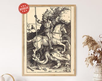 May include: A framed black and white print showing a knight on horseback fighting a dragon. The artwork is a detailed illustration with a vintage aesthetic, featuring a 'Bestseller' sticker in the upper left corner. The print is in a wooden frame.