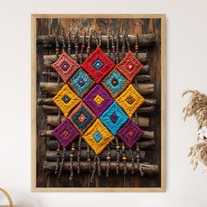 May include: A framed, colorful textile art piece. The artwork features a geometric design of woven squares in vibrant hues of red, blue, yellow, purple, and orange. The piece is mounted on a wooden background with decorative hanging elements.