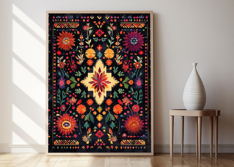 May include: A framed print of a colorful, intricate floral pattern on a black background. The design features a central starburst motif surrounded by various flowers and leaves.