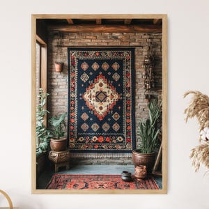 May include: A framed print of a vintage rug with a geometric pattern in shades of red, blue, and yellow. The rug is hanging on a brick wall with potted plants on either side.