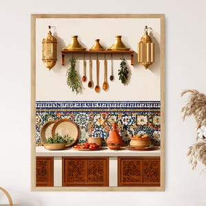 May include: A framed print depicting a kitchen scene with Moroccan design elements. The image features hanging lanterns, cooking utensils, and a shelf with tagines. Below, there are bowls, plates, and a terracotta pot, all set against a backdrop of patterned tiles and wooden cabinetry.