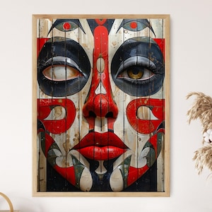 Può includere: Un'opera d'arte incorniciata raffigurante un volto stilizzato con audaci motivi geometrici rossi, neri e bianchi. Gli occhi sono dettagliati con iridi realistiche e lunghe ciglia. L'opera è montata su un pannello di legno, creando un forte contrasto visivo.