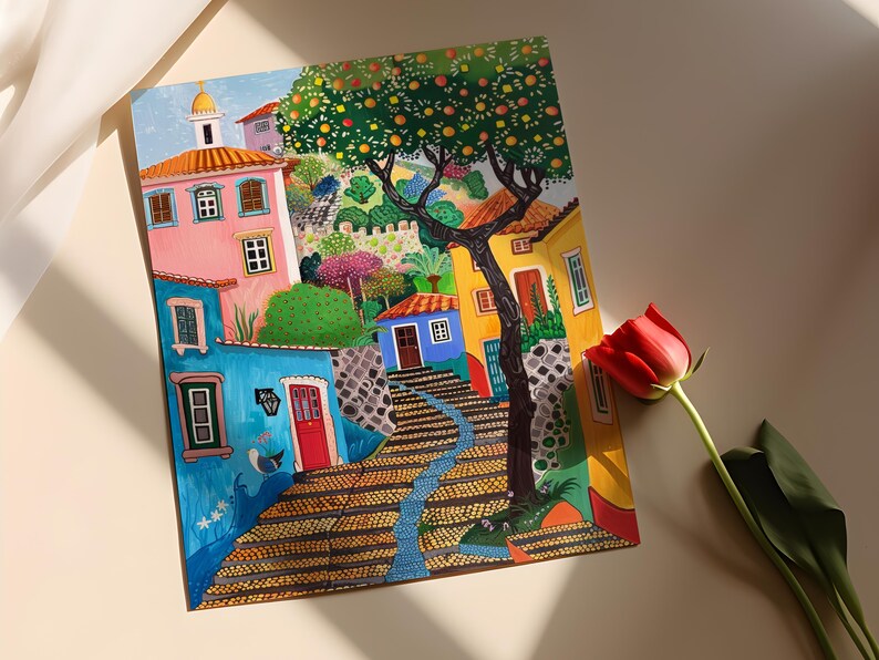 May include: Colorful painting of a European village scene. Buildings in shades of pink, blue, and yellow line a cobblestone street. A large tree with orange-colored fruit is in the center. A red rose is in the foreground.