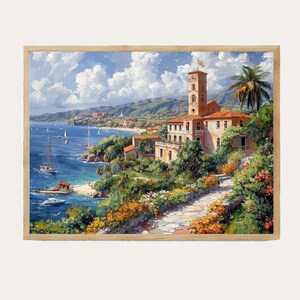 May include: A framed watercolor painting of a coastal scene. The artwork depicts a seaside town with a tall clock tower, buildings with red tile roofs, and a pathway lined with flowers. Sailboats dot the blue water under a cloudy sky.