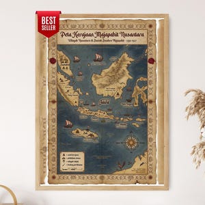 May include: A framed wall map titled Peta Kerajaan Majapahit Nusantara, featuring a vintage-style illustration of the Indonesian archipelago on a blue background with tan borders, sailing ships, a compass rose, and a legend with map symbols.