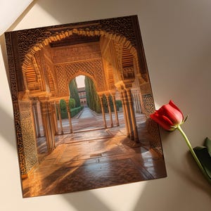 May include: A view through a grand archway in a historic building. The archway is made of intricately carved stone and leads to a courtyard with a tiled floor and lush greenery.