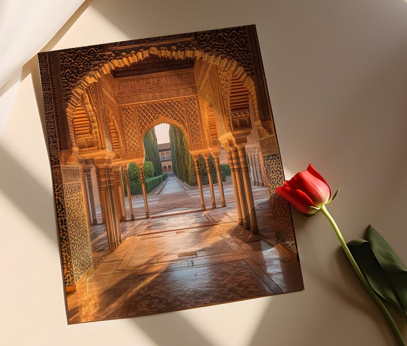 May include: A view through a grand archway in a historic building. The archway is made of intricately carved stone and leads to a courtyard with a tiled floor and lush greenery.