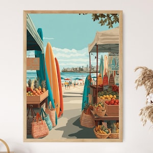 May include: A framed print depicts a beach scene with surfboards, a fruit stand, and people. The surfboards are in shades of blue, orange, and yellow. The fruit stand displays various fruits in wooden crates and baskets. The sky is a bright blue, and the beach is sandy.