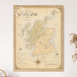May include: A framed historic map of Scotland featuring a beige parchment background, dark brown text, and detailed cartography. The map displays the Highlands, Lowlands, major towns, castles, and a compass rose, all enclosed in a light wood frame.