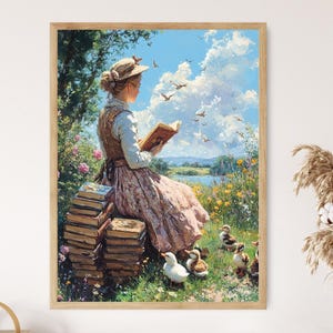 May include: A framed art print depicts a woman reading a book outdoors. She is seated near a stack of books, surrounded by flowers and ducks. The sky is blue with fluffy clouds and birds in flight. The artwork has a vintage, pastoral theme.