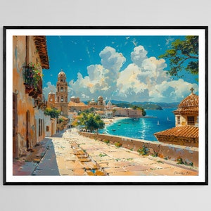 May include: A framed art print of a coastal town scene. The artwork depicts a cobblestone street leading to a bay with boats. Buildings with orange roofs and a church tower are visible under a bright blue sky with fluffy clouds.