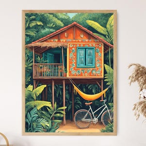 May include: A framed art print depicts a vibrant tropical scene. A stilt house with an orange facade, teal shutters, and a thatched roof is surrounded by lush green foliage. A yellow hammock hangs below, and a white bicycle rests nearby.