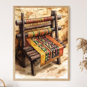 May include: Watercolor painting of a wooden loom with colorful threads and a woven textile. The loom is brown, and the textile features yellow, green, red, and black patterns. The artwork is framed in a light brown wooden frame.