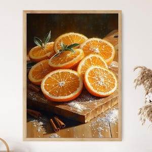 May include: A framed print featuring a still life of sliced oranges with green leaves, arranged on a wooden cutting board. Cinnamon sticks and a dusting of white powder are also present. The artwork has a warm, inviting color palette.