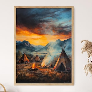 May include: A framed landscape painting depicts a Native American camp at sunset. Several teepees are clustered near a lake, with campfires burning in front. The sky is a mix of orange, yellow, and blue, with mountains in the background.
