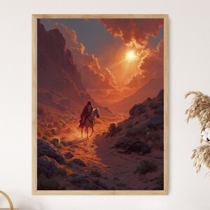 May include: Framed art print depicting a lone rider on horseback traversing a desert landscape. The artwork features a warm color palette of oranges and reds, with a bright sun shining through the clouds. The scene evokes a sense of adventure and solitude.