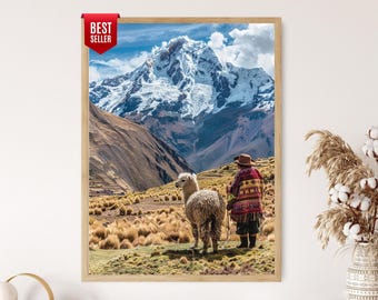 Puede incluir: Una impresión enmarcada que presenta un paisaje montañoso con una cima nevada. Una alpaca se encuentra en un campo cubierto de hierba con una persona vestida con ropa tradicional. La impresión está etiquetada como "Best Seller".
