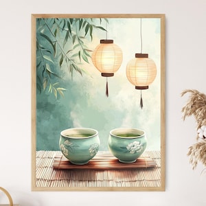 May include: A framed print featuring a serene tea ceremony scene. Two teal tea bowls with floral designs sit on a bamboo mat. Above, two paper lanterns hang against a soft, watercolor-style background. The artwork evokes a sense of calm and tranquility.