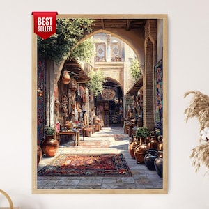 May include: A framed print of an outdoor market scene. The image features a long, arched walkway lined with shops displaying rugs, textiles, and decorative items. The color palette includes warm tones of red, brown, and gold, with a "Best Seller" tag in the upper left corner.
