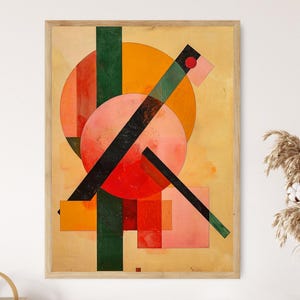 Puede incluir: Impresión artística abstracta con formas geométricas en tonos naranja, rojo, rosa, verde y negro. La obra de arte está enmarcada en un marco de madera clara, lo que le da un aspecto vintage. La composición incluye círculos, rectángulos y líneas diagonales.