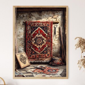 May include: A framed print of a rustic scene featuring a red and black patterned rug hanging on a stone wall. A smaller framed piece with text, scissors, and a small rug are on the floor. The scene is illuminated by natural light.