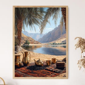 May include: A framed wall art print depicting a desert oasis scene with a sandy shore, palm trees, and mountains in the background. In the foreground, a red patterned rug holds a brass teapot, two brass pitchers, two brass cups, and a stack of plates.