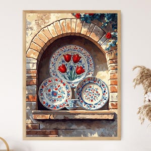 May include: A framed print featuring a collection of decorative plates and a small cup. The plates have a white background with red and blue floral designs. The largest plate displays red tulips. The artwork is set in a brick archway.
