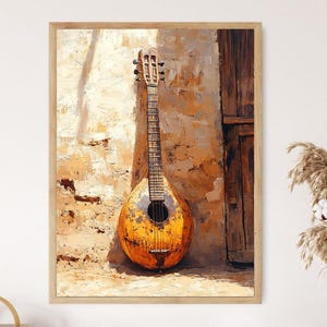 May include: A framed painting of a lute leaning against a textured, sunlit wall. The lute is primarily yellow and brown, with a dark sound hole. The background features a wooden door and a wall with a rough, aged appearance. The artwork is displayed in a light-colored wooden frame.