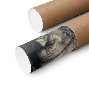 May include: Two brown cardboard tubes, one partially unrolled, displaying a black and white print of a person's face. The print is detailed, showing wrinkles and closed eyes. The tubes have white end caps.