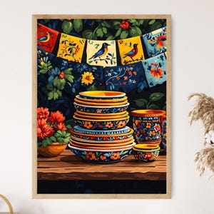 May include: A framed art print featuring a still life of colorful ceramic dishes and a small bowl, stacked on a wooden surface. A garland of decorative flags with bird illustrations hangs above. The background includes floral patterns and a vase with dried plants.