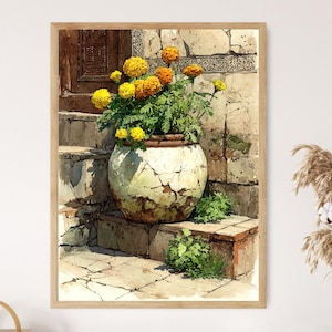 May include: Watercolor painting of a large, cracked, white and green ceramic pot filled with vibrant yellow and orange flowers. The pot sits on stone steps, with a stone wall and wooden door in the background. The artwork is framed in a light brown wooden frame.